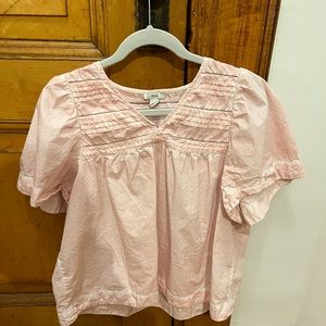 Anthropologie top, small holes around sleeves from safety pins